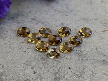 Load image into Gallery viewer, Champagne Quartz Domed Oval Facets - 6x8mm
