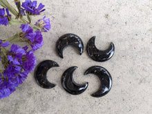 Load image into Gallery viewer, Nuumite Crescent Moon Cabochons
