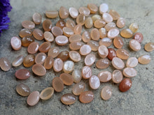 Load image into Gallery viewer, Peach Moonstone Oval Cabochons - 5x7mm
